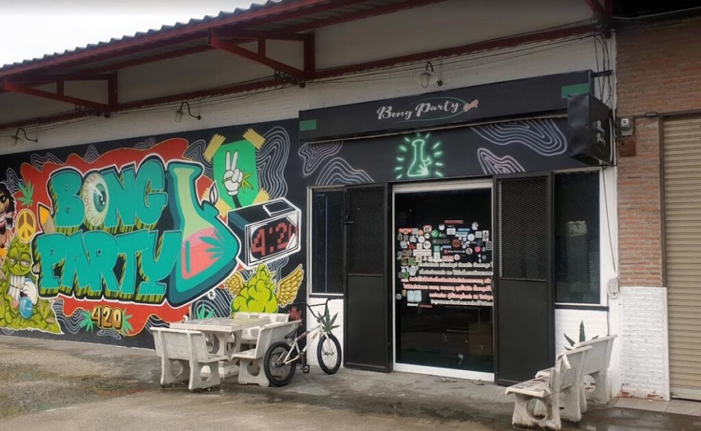 Storefront and grafitti mural of Bong Party