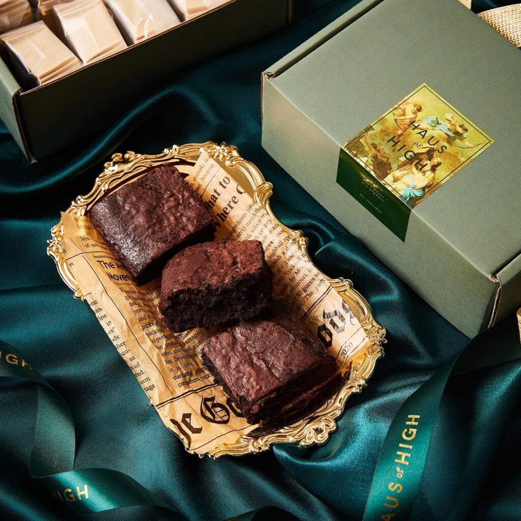 three weed brownies next to packaging