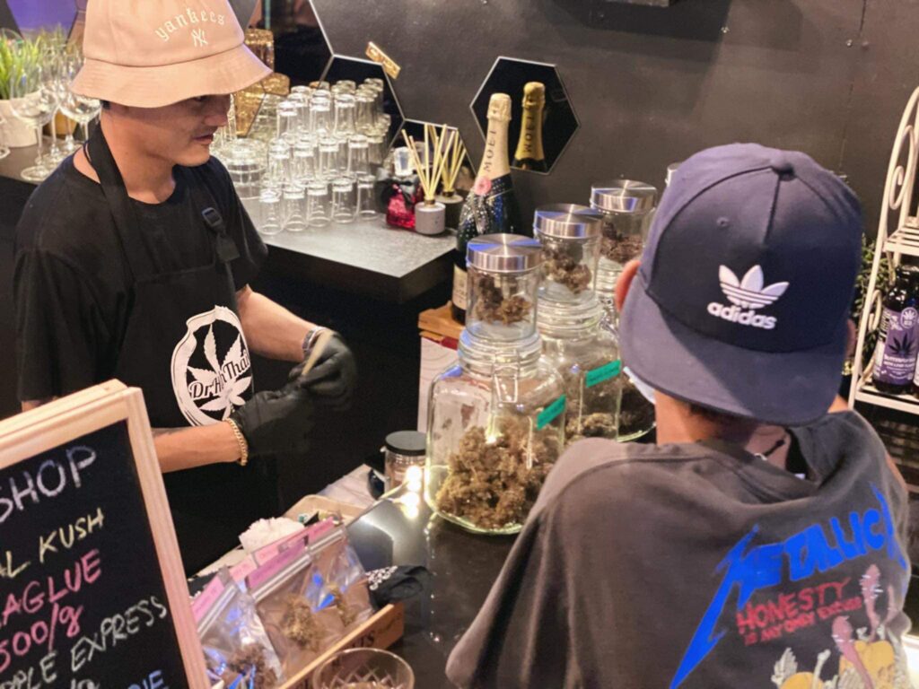 man selling cannabis in a bar in Hua Hin