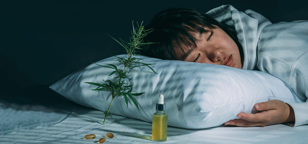 Woman sleeping next to CBD medicine in Thailand