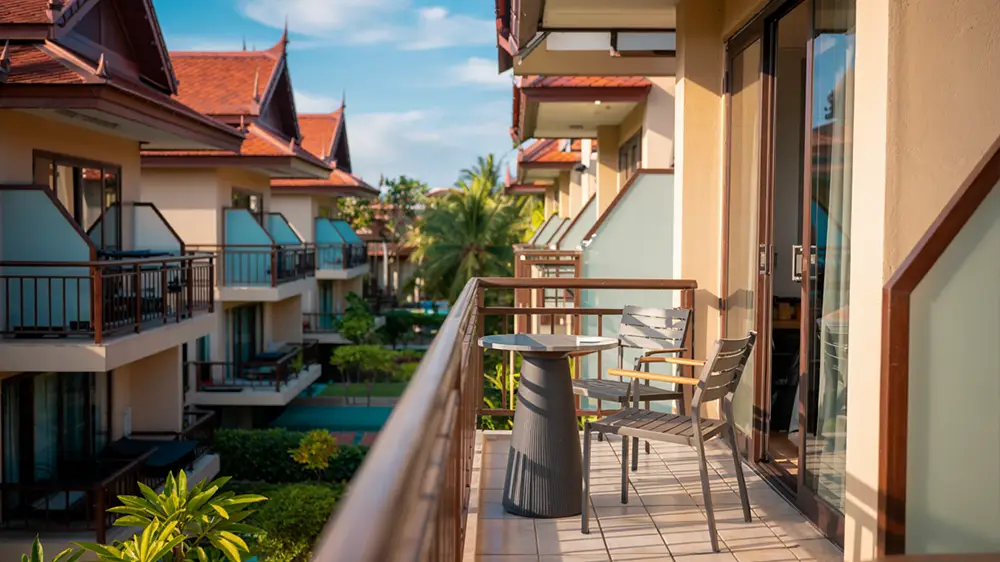 View of multiple closely spaced hotel balconies in Thailand, highlighting potential issues with public cannabis smoking.