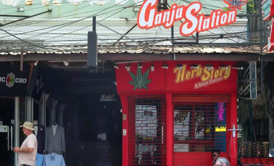 A cannabis dispensary in Thailand with shutters closed, reflecting the new 2025 law restricting marijuana sales to licensed medical clinics only.